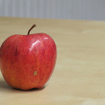 a red apple on a table