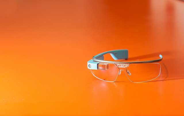 a pair of safety glasses on an orange surface