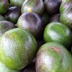 a pile of avocados