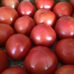a group of tomatoes in a box