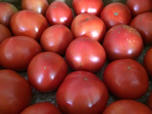 a group of tomatoes in a box