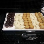 a tray of pastries and muffins