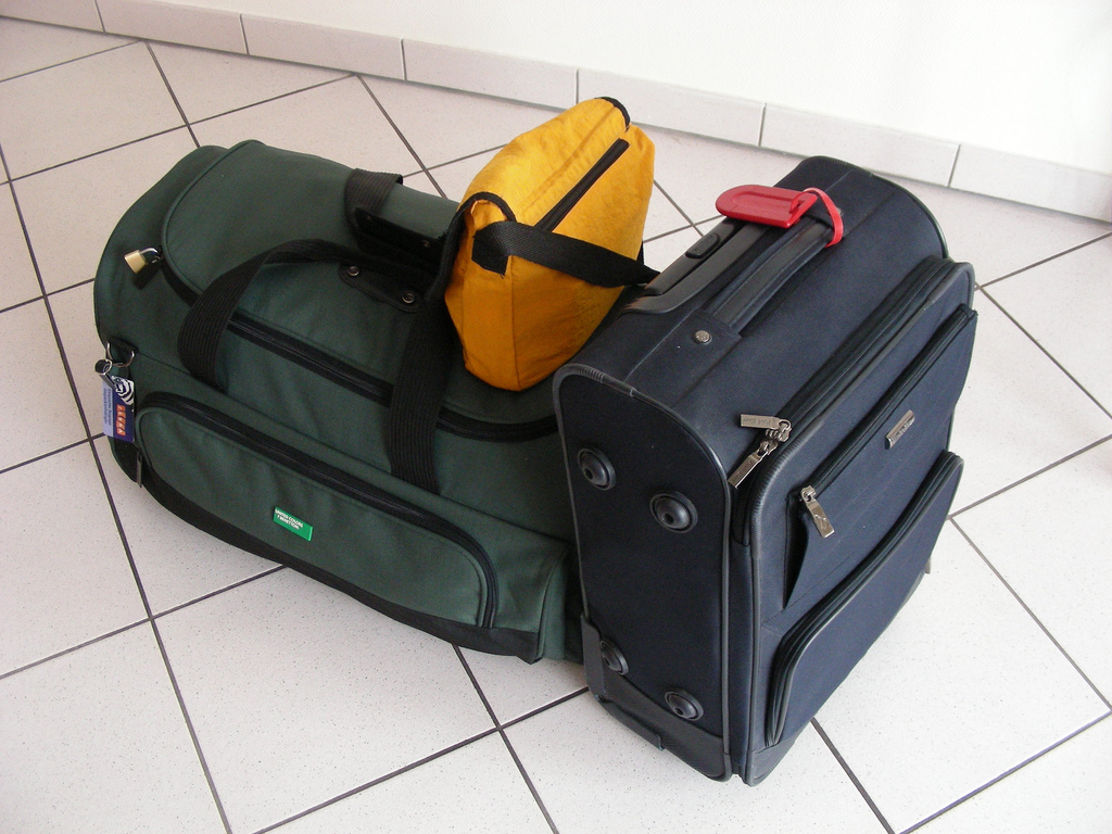 a group of luggage on a tile floor