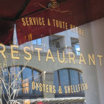 a restaurant sign on a window