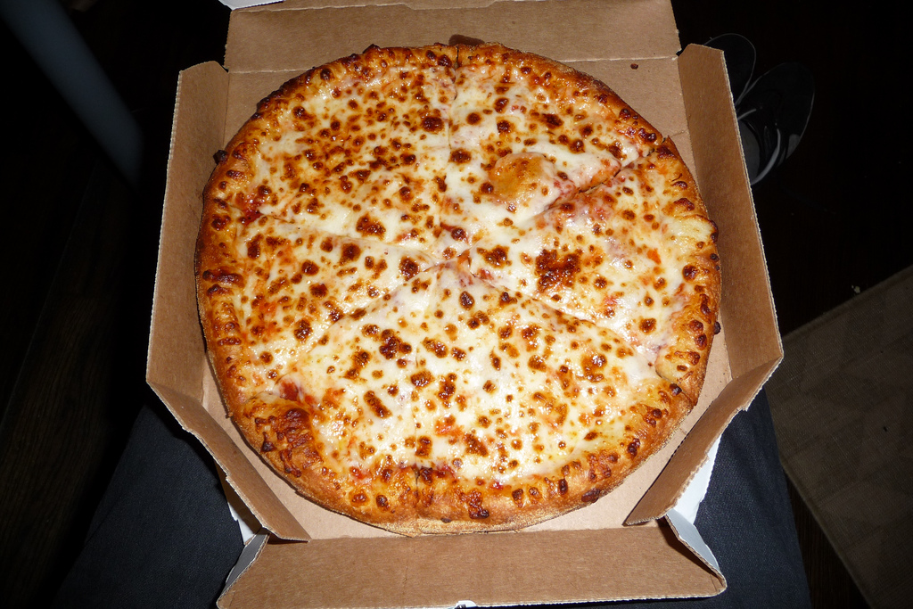 a cheese pizza in a box