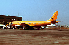 a yellow airplane on the runway