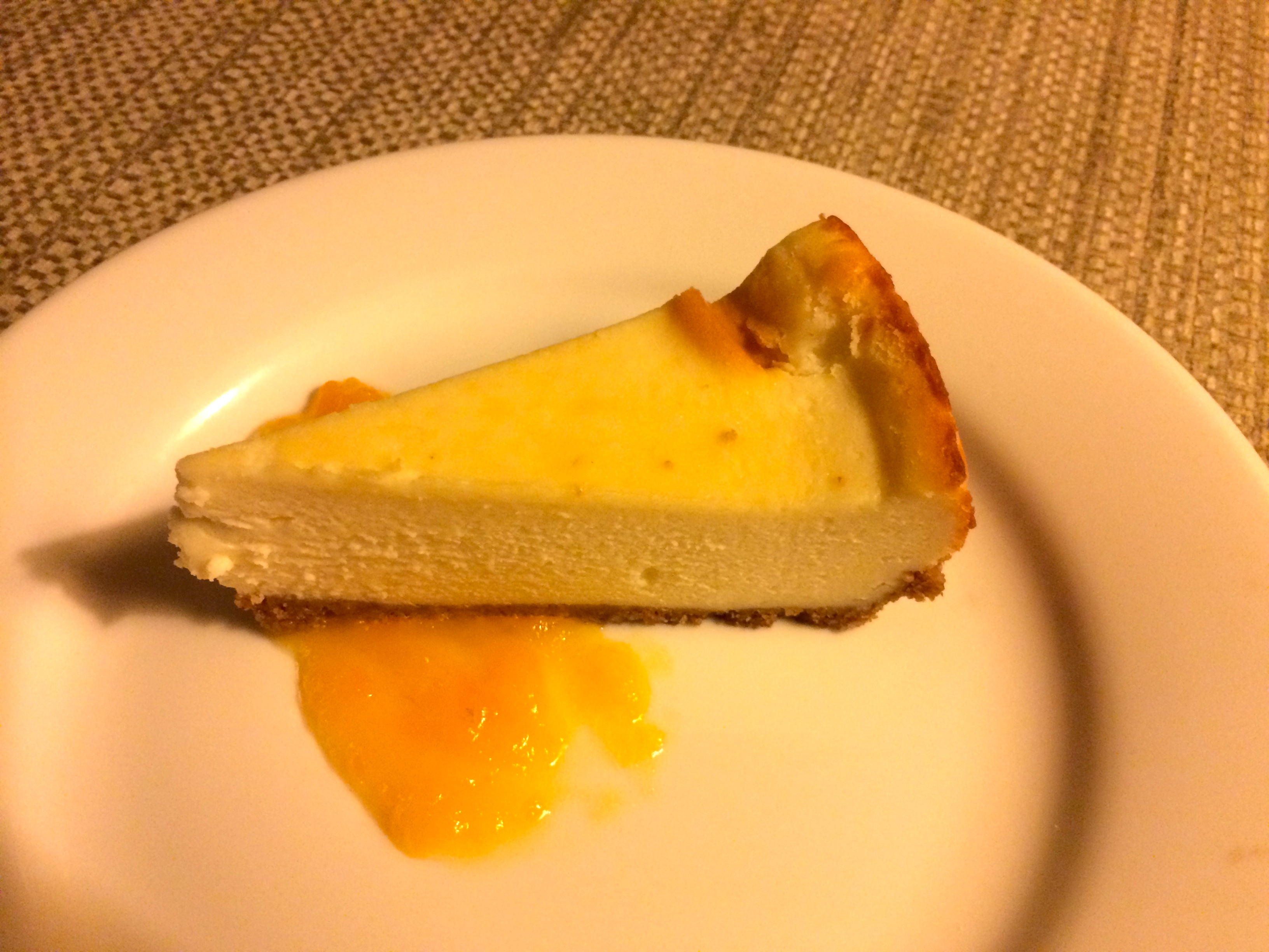 a slice of cheesecake on a white plate