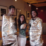 a group of people holding foil