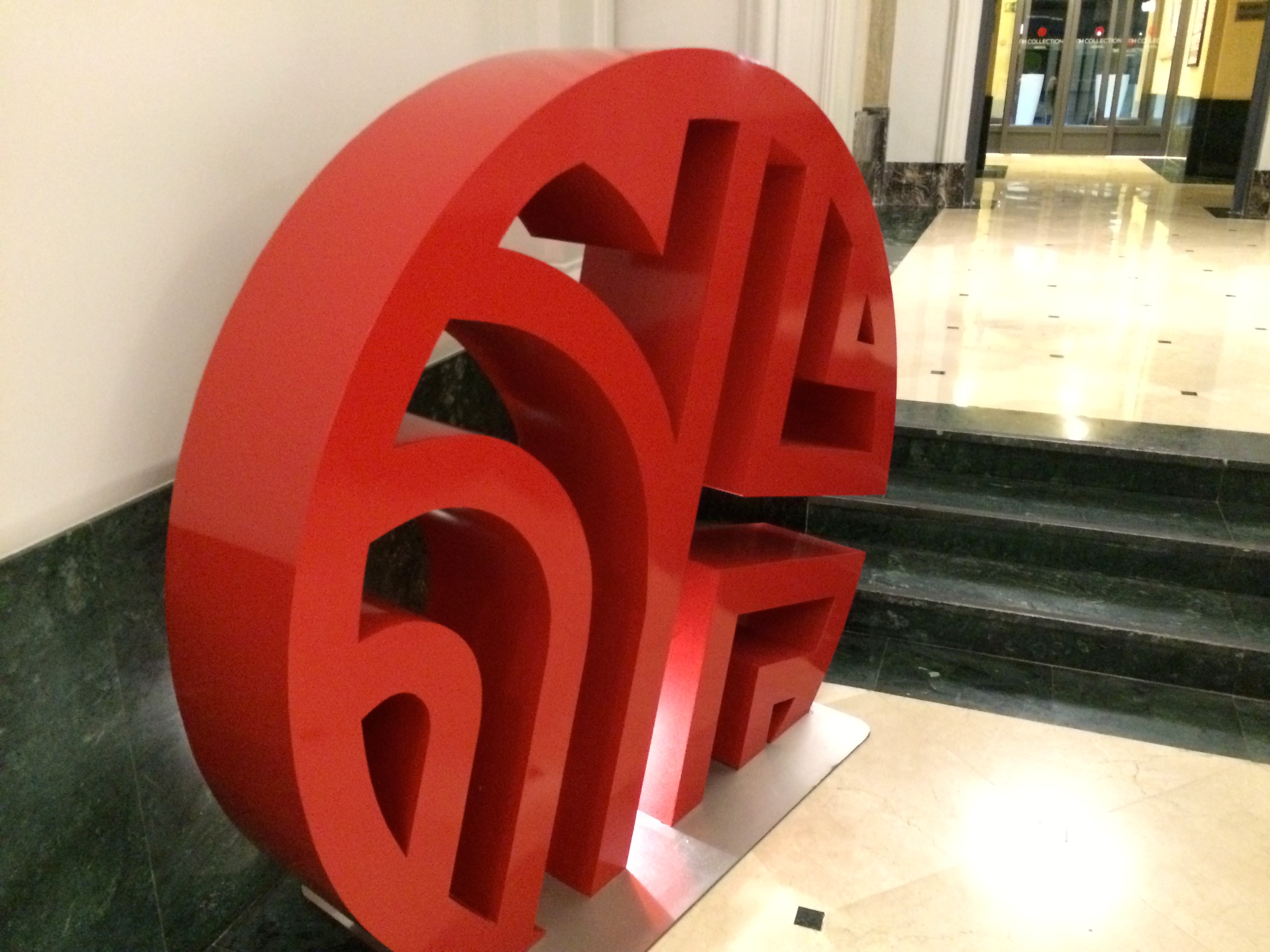 a red sculpture in a hallway