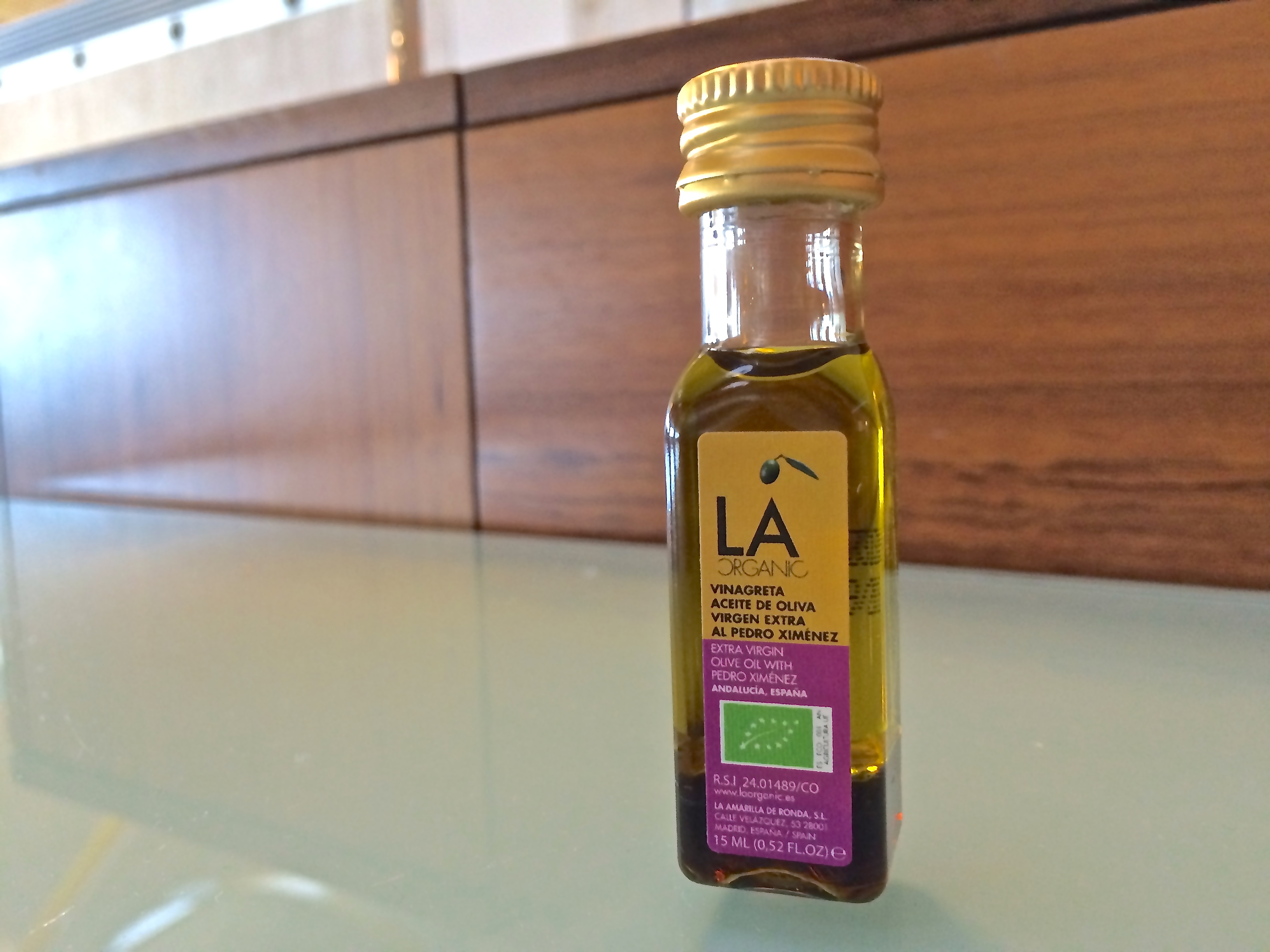 a small bottle of oil on a table
