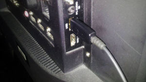 a close-up of a cable plugged into a computer monitor