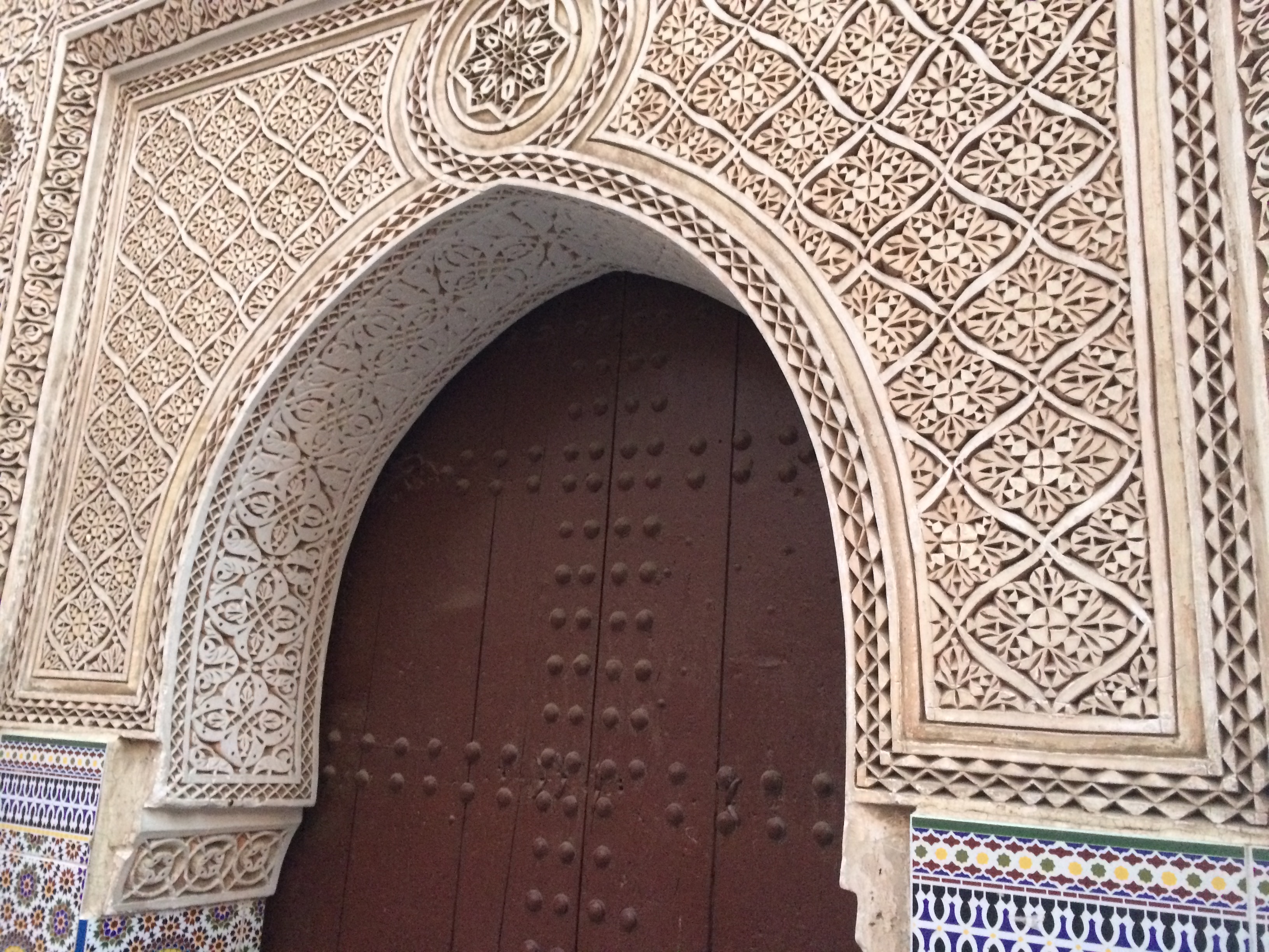 a ornate doorway with a tile design