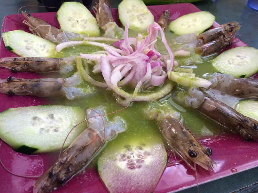 a plate of shrimp and cucumbers
