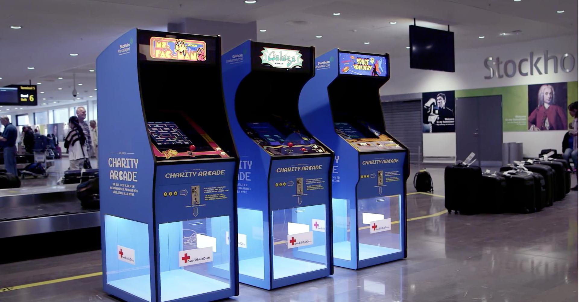 a group of arcade machines in a room