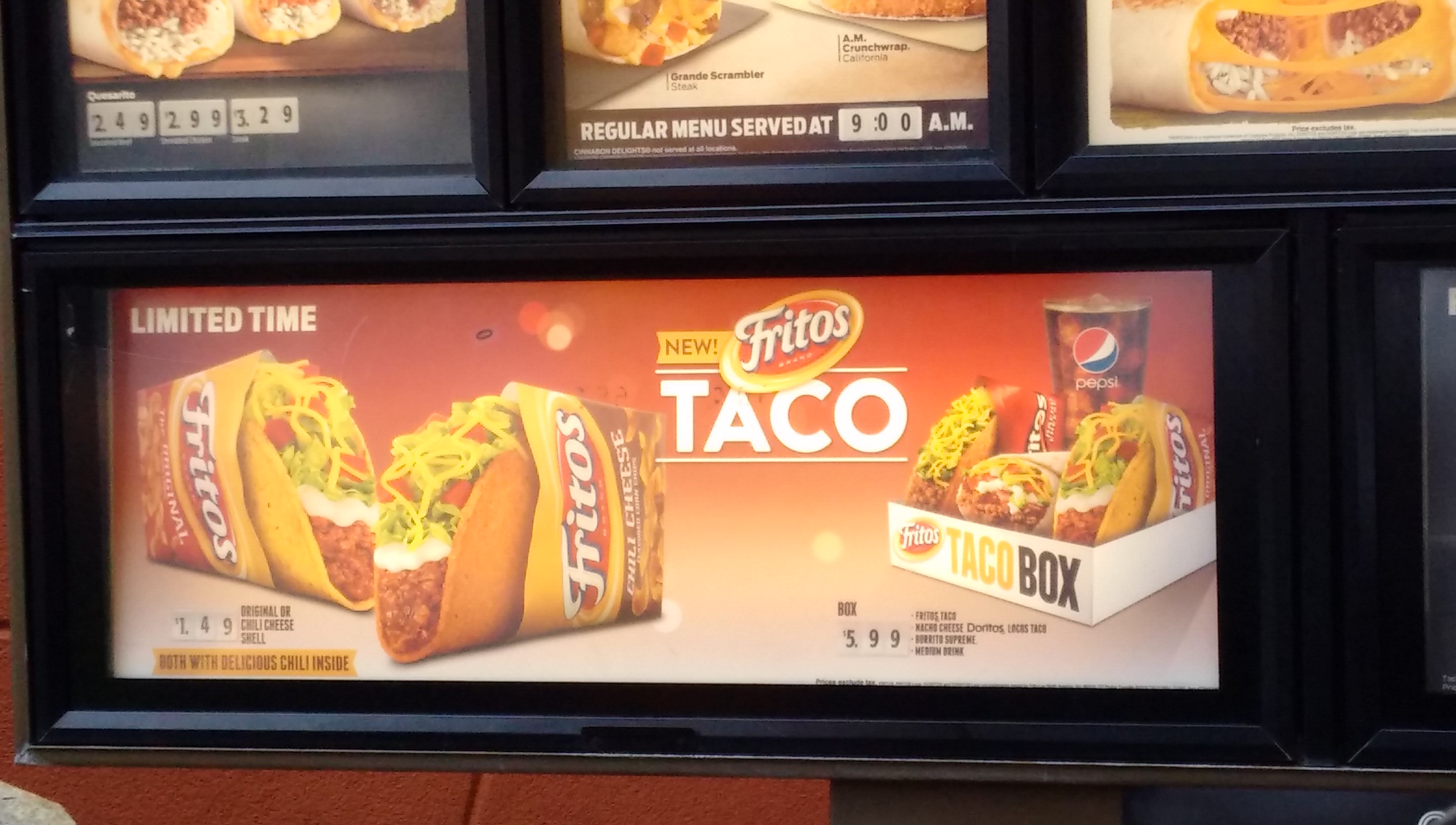 a sign with tacos and soda