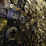 a wall of various metal belts