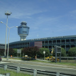 a building with a control tower and a flag on it