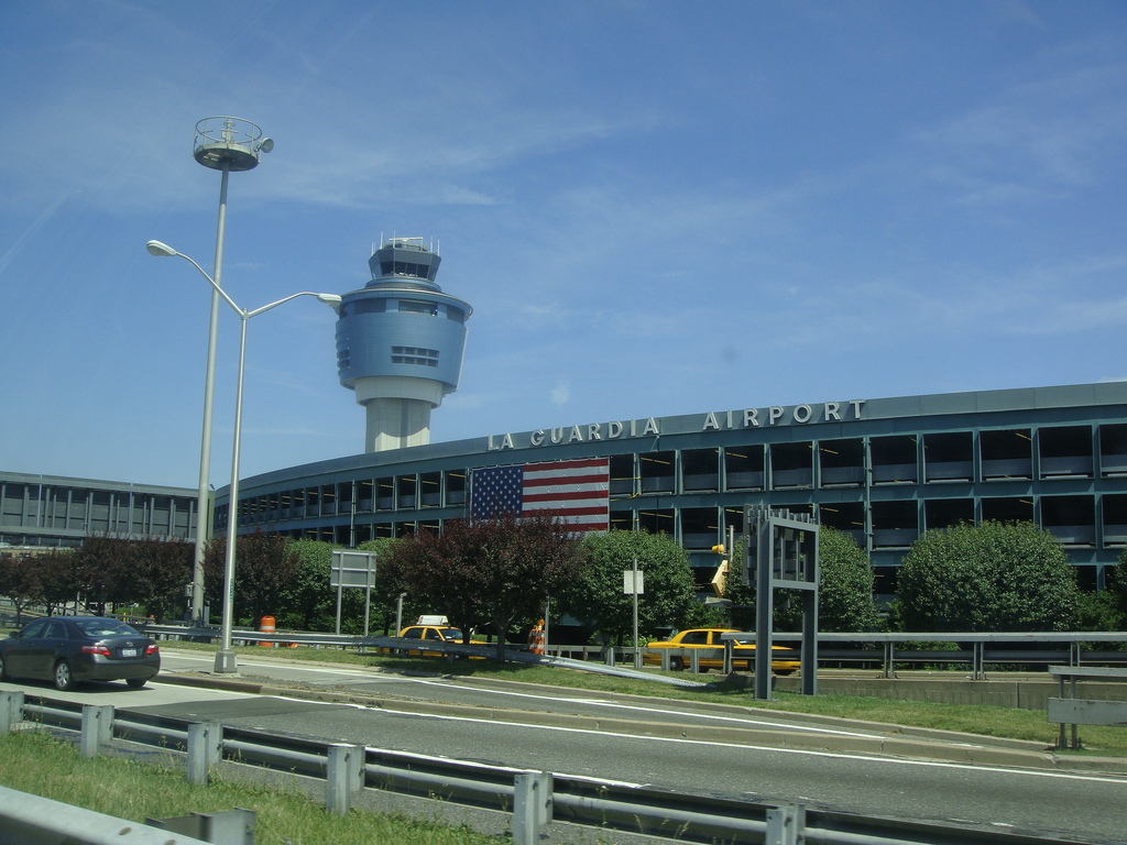 a building with a control tower and a flag on it