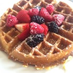 a waffle with berries on top