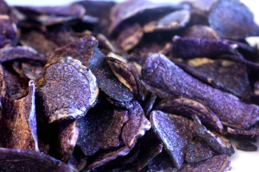 a pile of purple potato chips