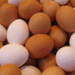 a group of brown and white eggs