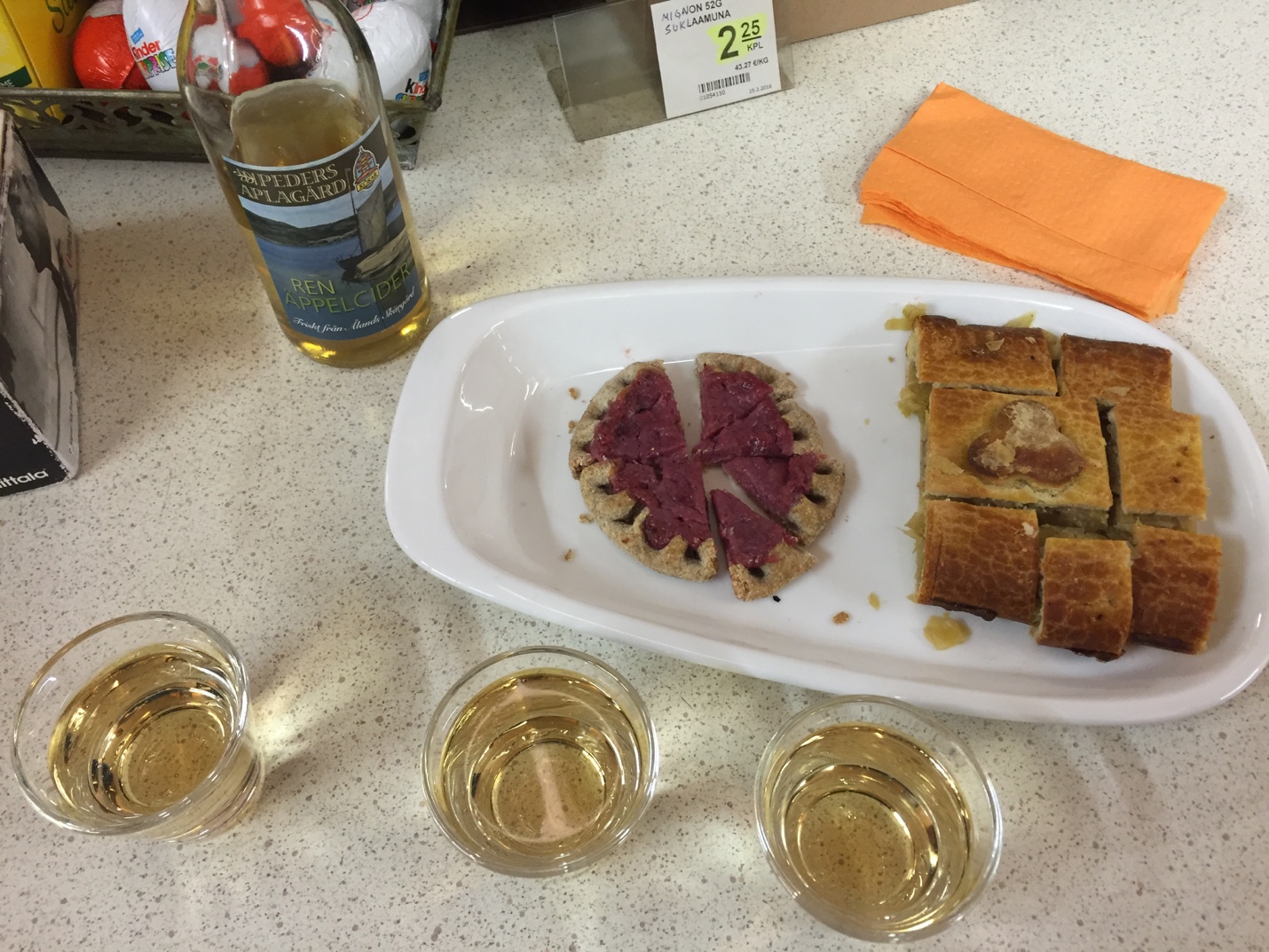 a plate of food and glasses of alcohol