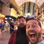 two men taking a selfie in a shopping mall