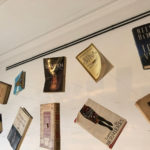 a group of books from a wall